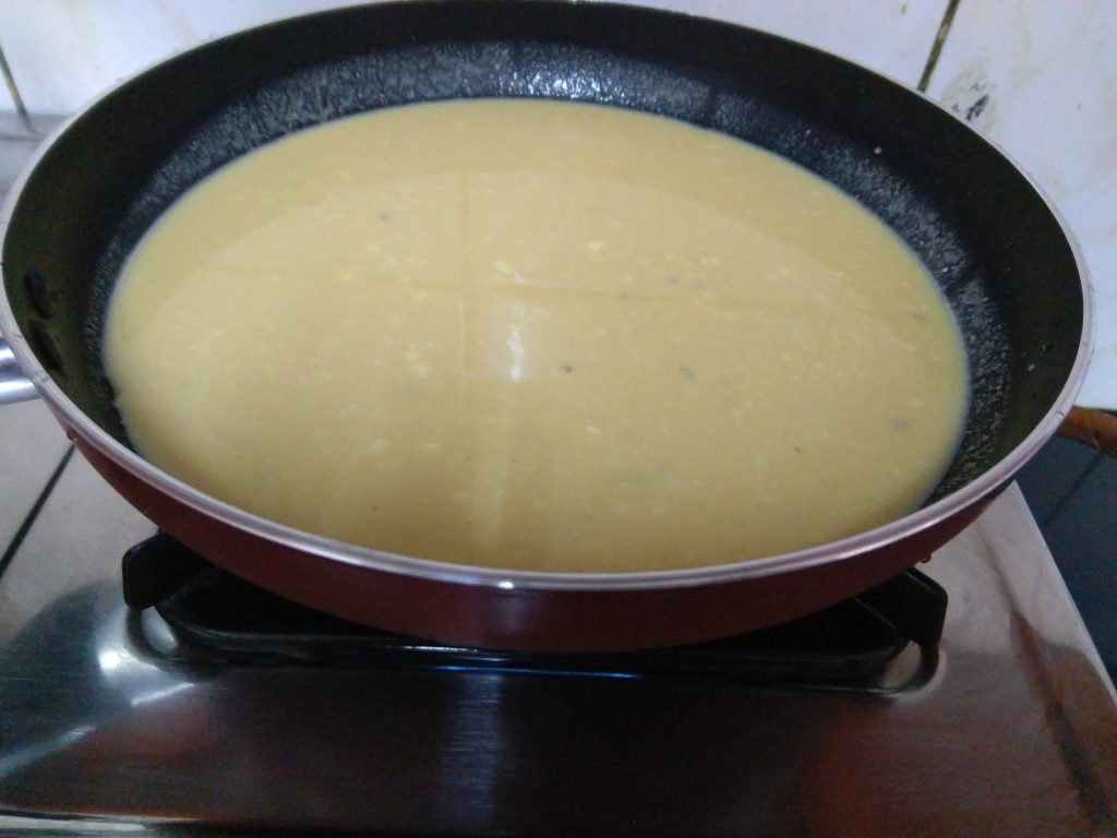 Khandvi batter in a Flat bottomed frying pan