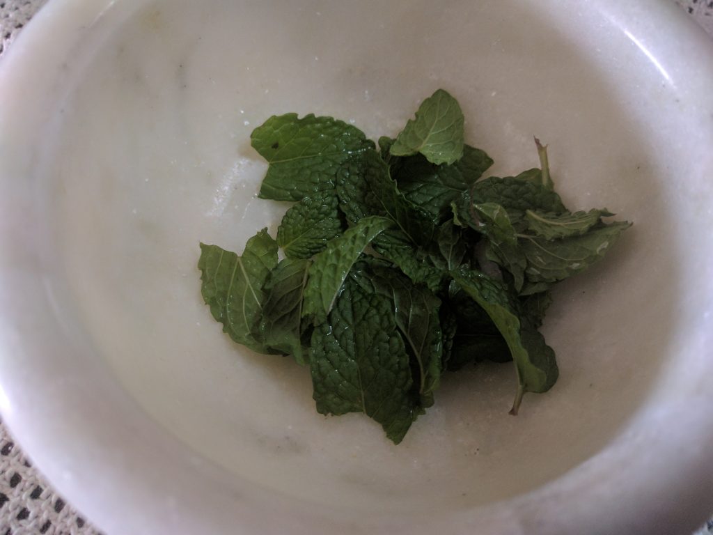 Fresh Mint Leaves in a Mortar