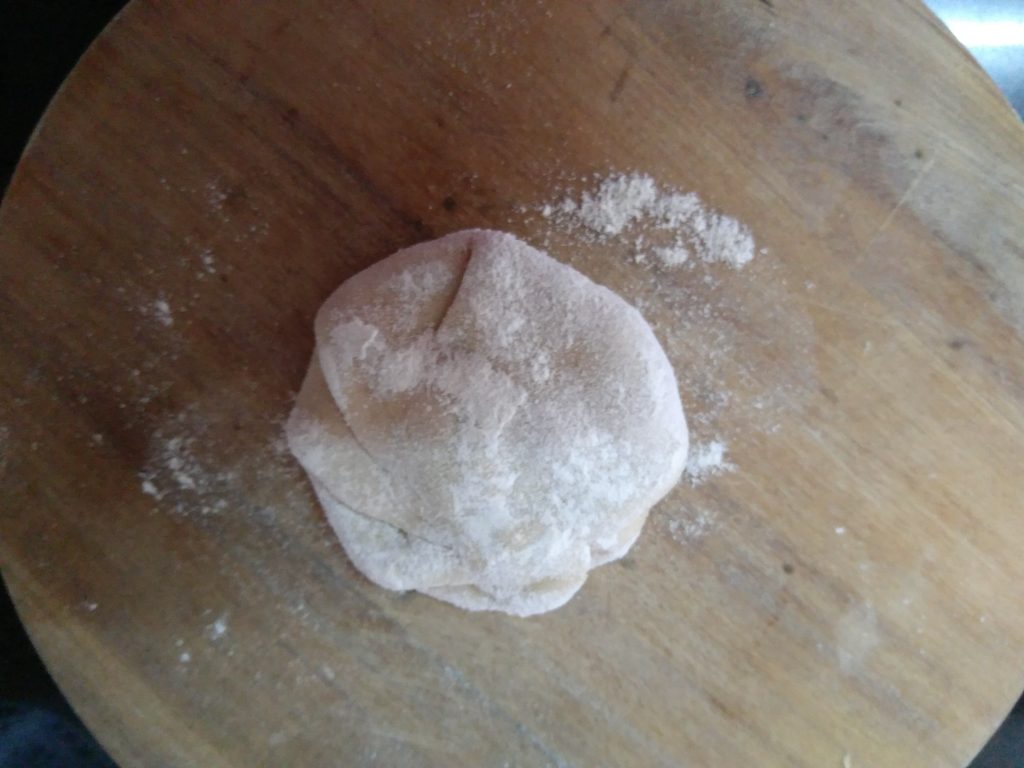 Sprinkled some Flour over the stuffed Dough