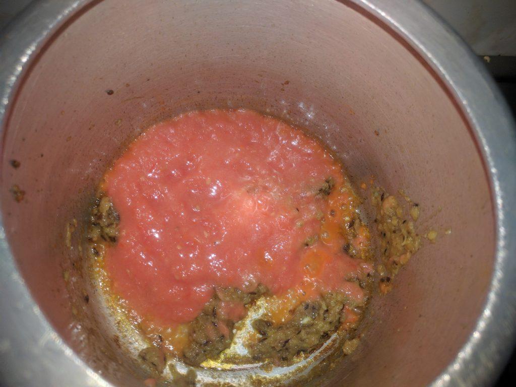 Adding tomato Puree